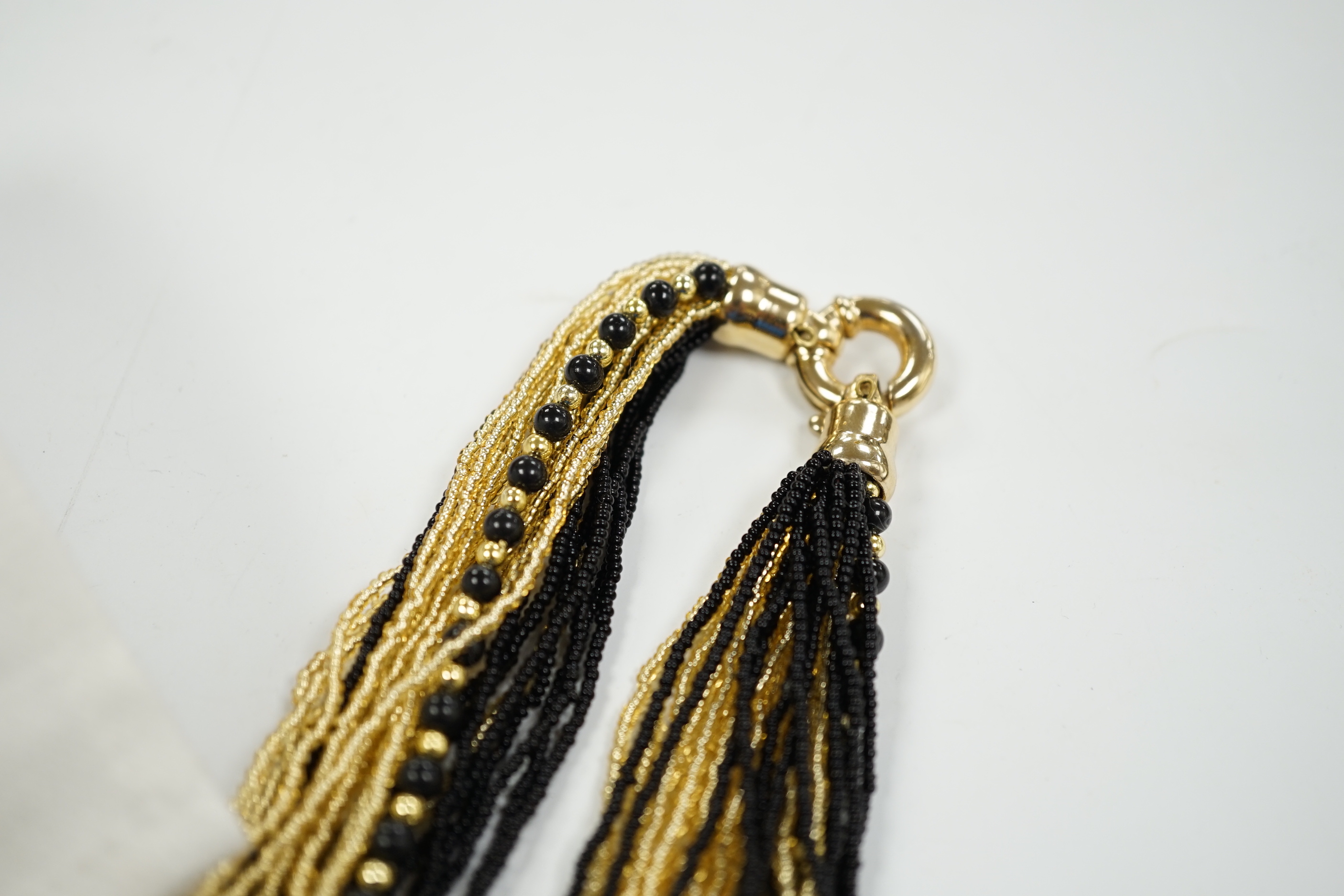 A Christian Dior Danseuse Etoile gilt bracelet, 18cm, with Dior box and pamphlet etc. together with a Luciani Murano glass bead twist necklace, 48cm.